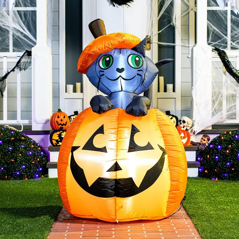Five-foot illuminated cat on pumpkin Halloween inflatable in a front yard