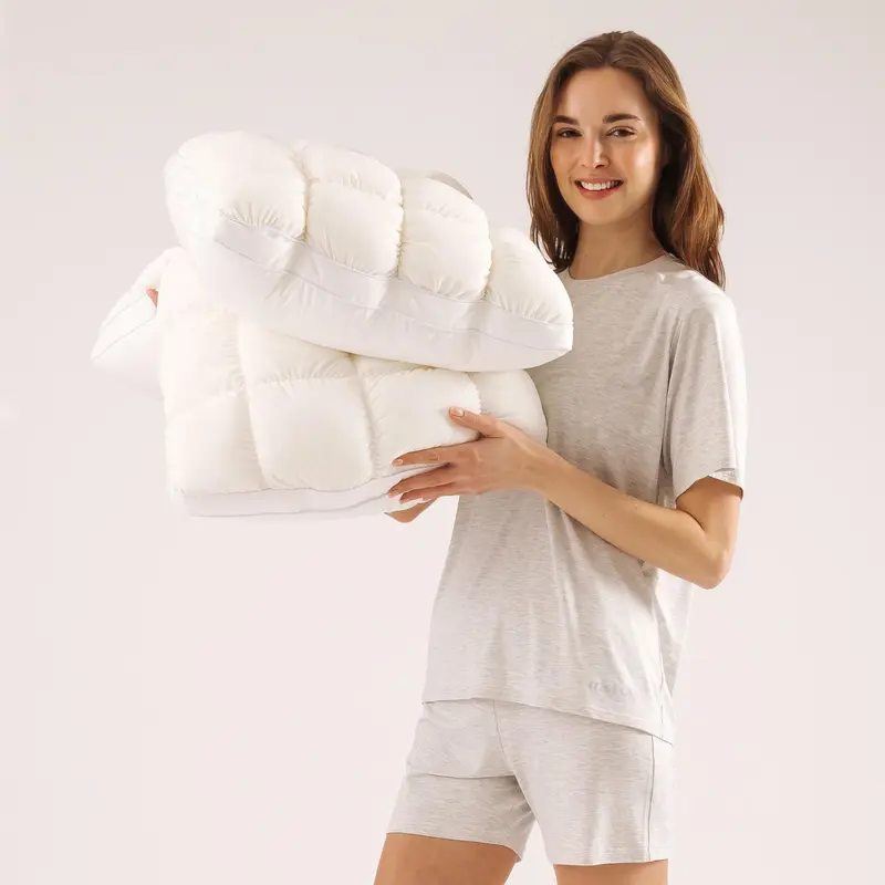 White CloudSoft extra-fluffy cooling puff-grid pillows in a lifestyle setting