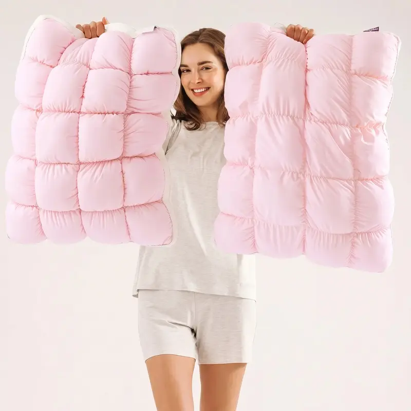 Baby pink CloudSoft pillows showing the puff-grid shape